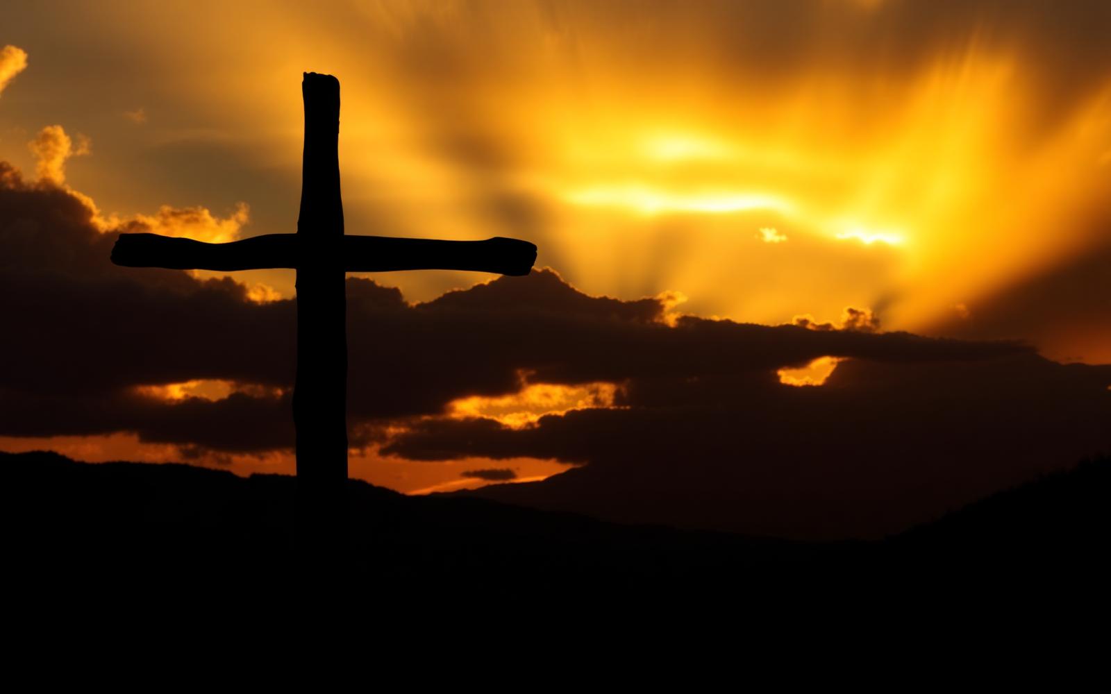Cross silhouette at sunset
